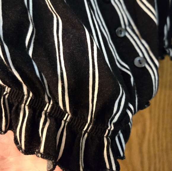 Cute off the shoulder black and white stripped blouse with elastic around waist. - Picture 4 of 5